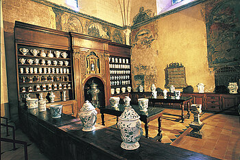 The hospital pharmacy exhibited in the Great Hall for the Sick since 1962 and the cloister located on the West side consists of three galleries two of which are Roman style &copy; Angers City- Picture Thierry Bonnet